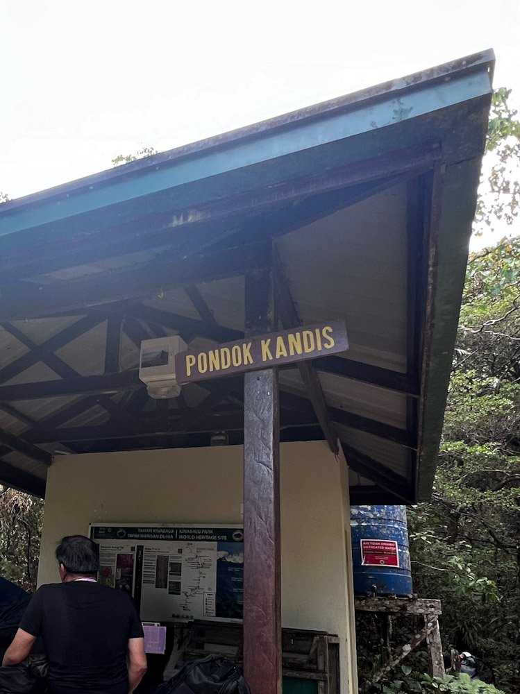 Pondok Kandis first rest hut along Mount Kinabalu trail at around 1km in, surrounded by forest in Kinabalu Park Sabah Malaysia. © SlowingwithT.com